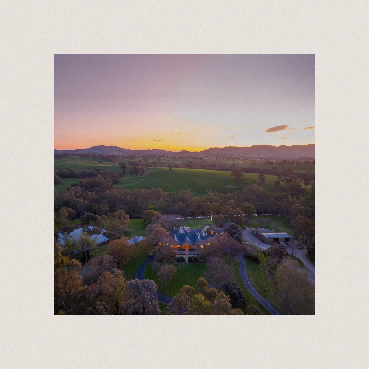 Prestige farming property aerial drone at dusk for Mylora in Southern Tablelands showcasing 3,209 hectare mixed enterprise landscape with golden hour atmospheric lighting