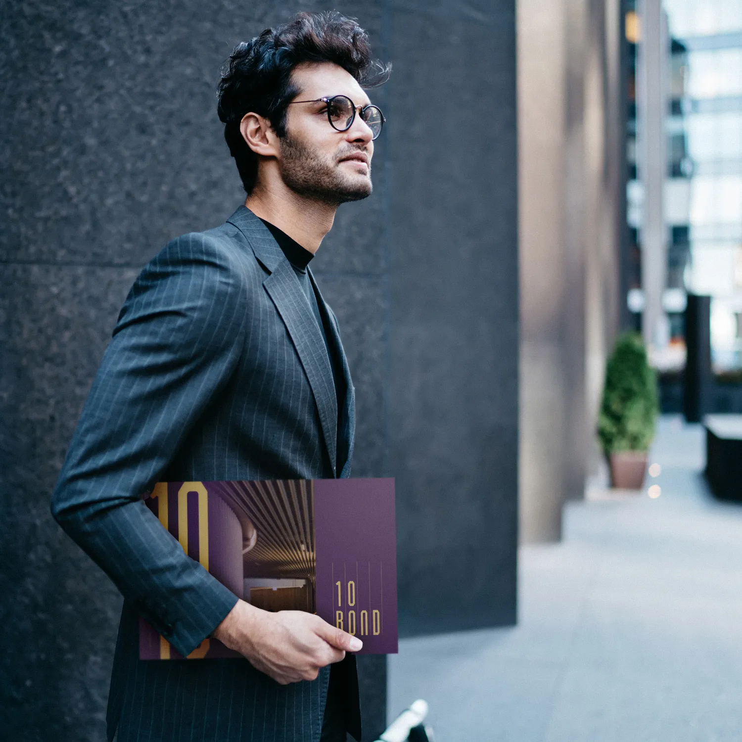 Corporate investment collateral photography featuring executive with branded memorandum for commercial property marketing materials