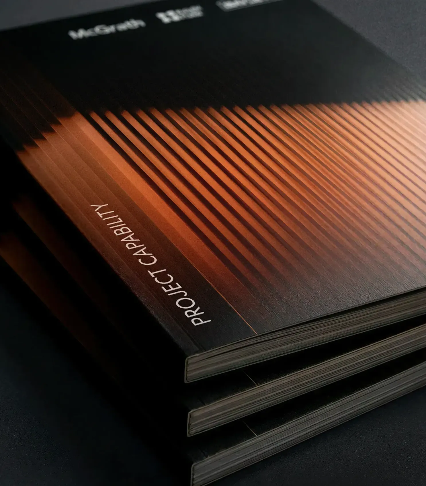 Property developer print designers premium paper stock — McGrath Knight Frank Projects capability statement spine detail, print collateral agency